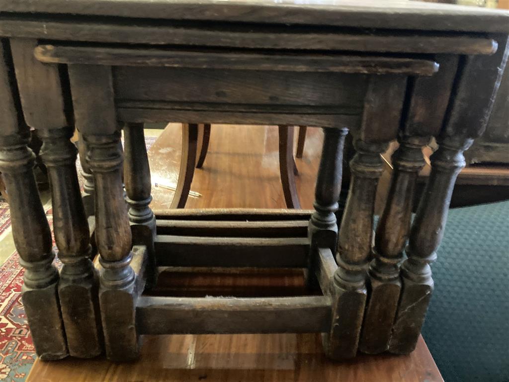 A nest of three 17th century style rectangular oak tea tables, width 61cm, depth 34cm, height 48cm